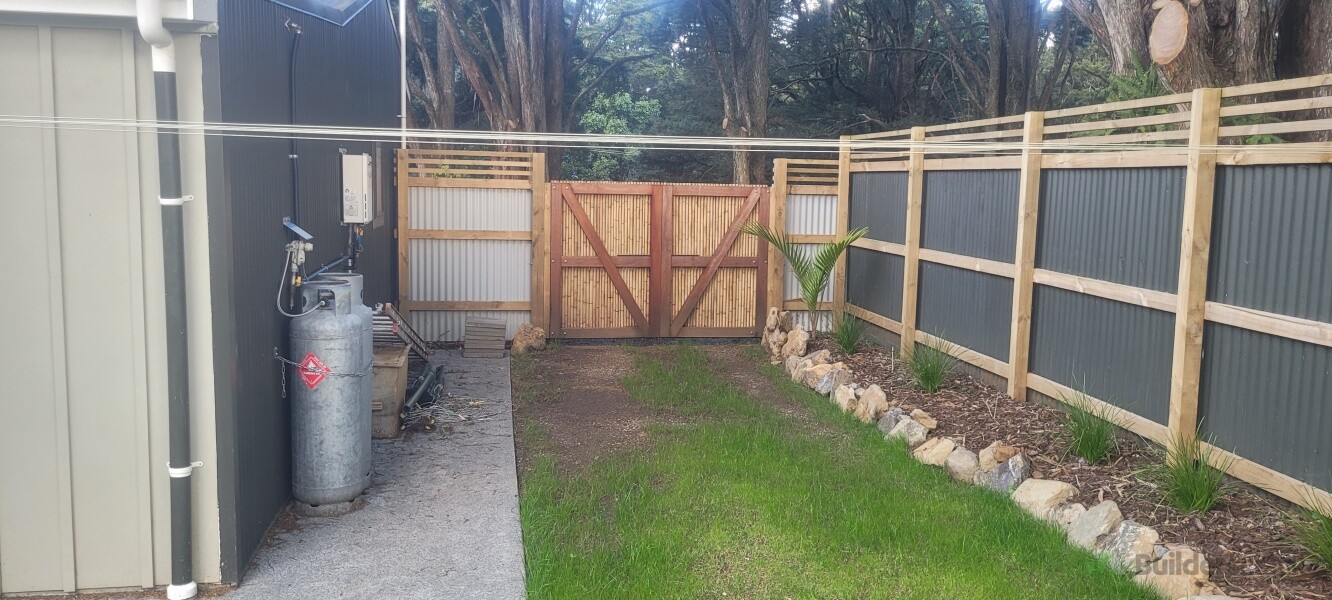 Iron fencing, kwilla and bamboo gate