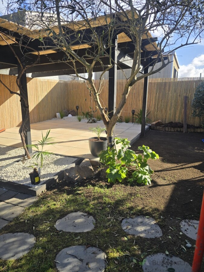 After photos of tiled area with bamboo fencing and roofing