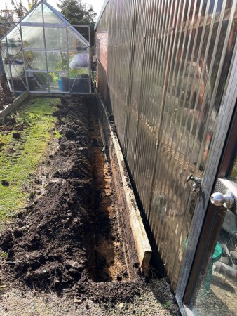 Dug out with just enough room to drill new pile holes and remove old retaining, while disrupting as little of the clients lawn space as possible
