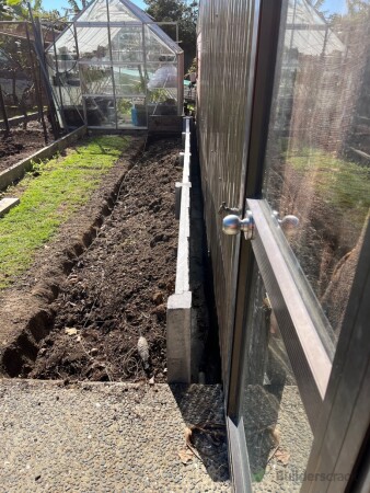 This is the after photo, ready for the client to top up with garden mix and their new vegetable garden