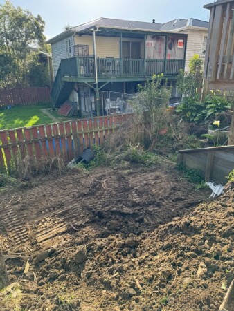 Ground leveling for retaining wall and graveled terrace