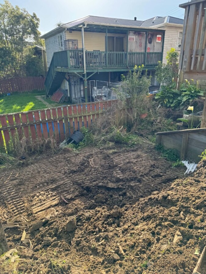 Ground leveling for retaining wall and graveled terrace