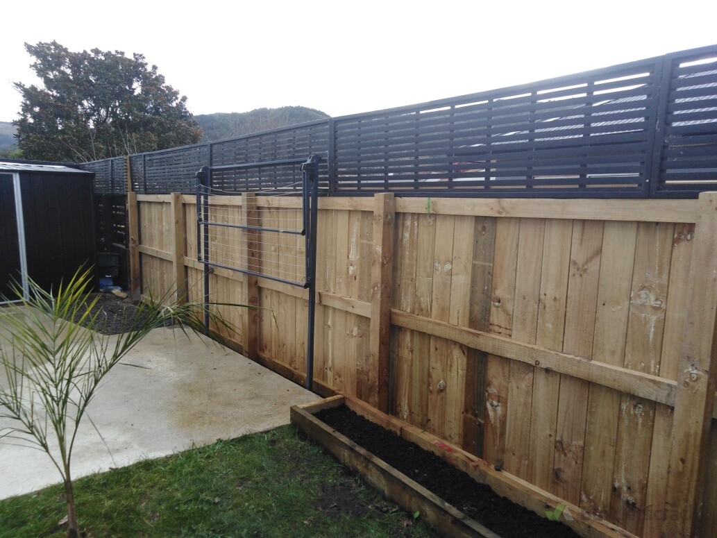 Installed fence with topper, concrete pads, washingline and shed