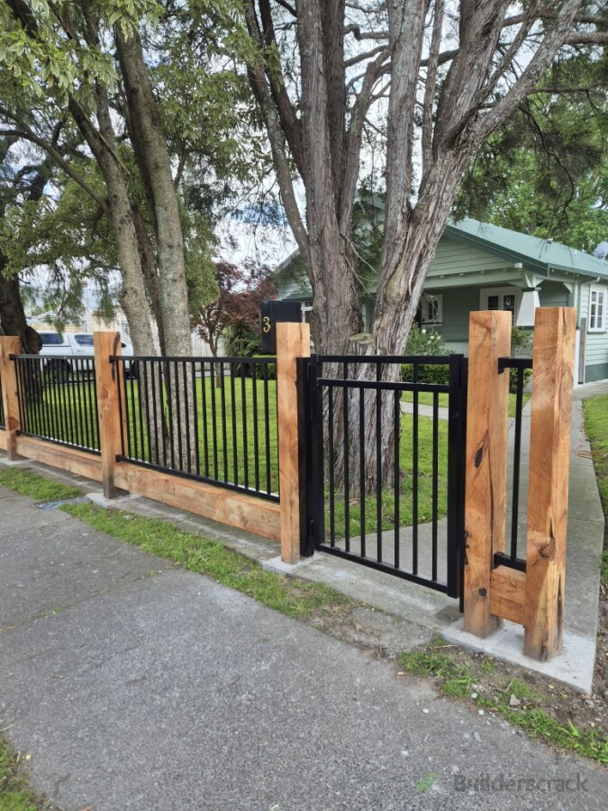 Flat top aluminium panel infill fencing and 1.8m milled marcrocarpa posts treated with raw linseed oil.  Milled to 100x200mm dimension.  Ngaruawahia