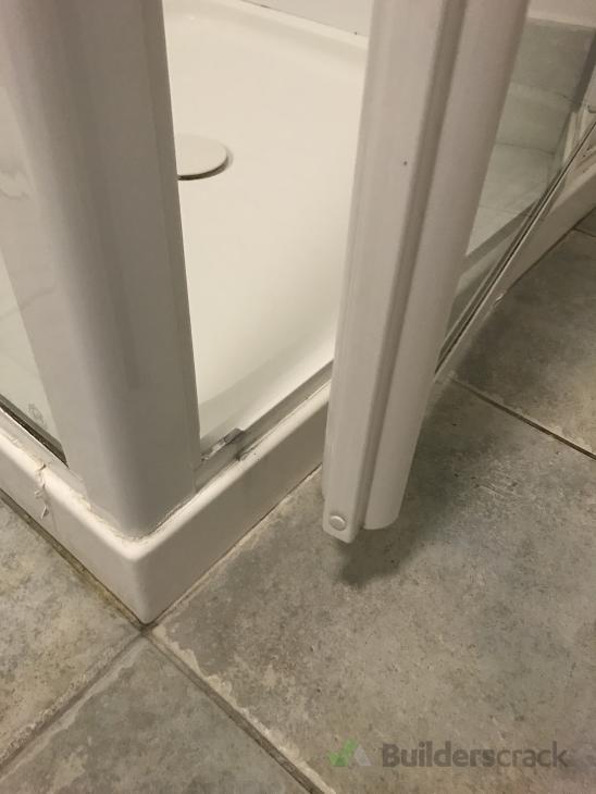 Re seal shower & realign shower door ( 358607) Builderscrack