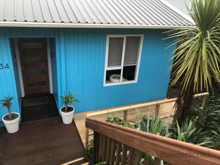 Decorative facings and shutters around aluminium windows