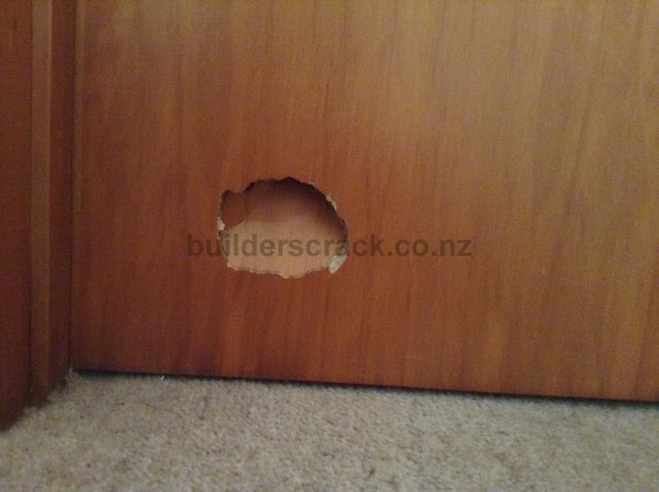 Wooden door hole repair. (# 41299) | Builderscrack