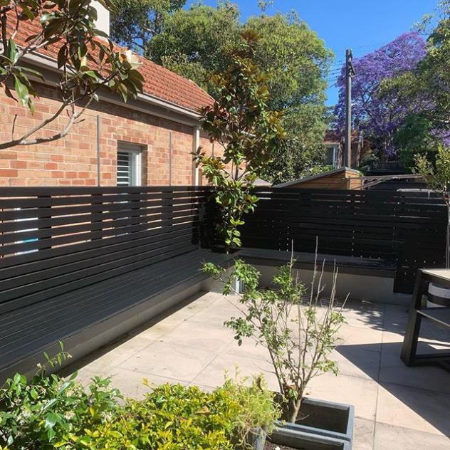Custom Outdoor Seating Area with Trellis Privacy Screen
