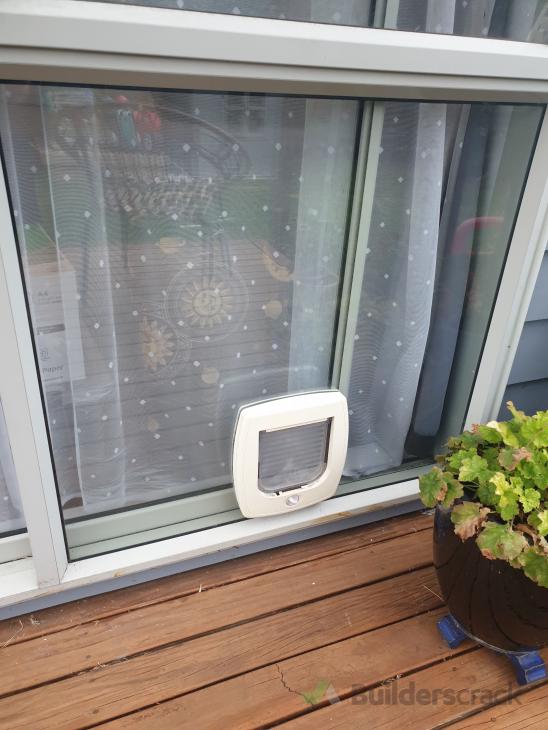 Replace Cat door with larger Dog door in Ranch slider fixed pane