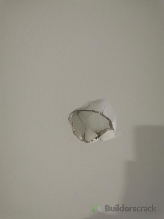 hole in plaster wall