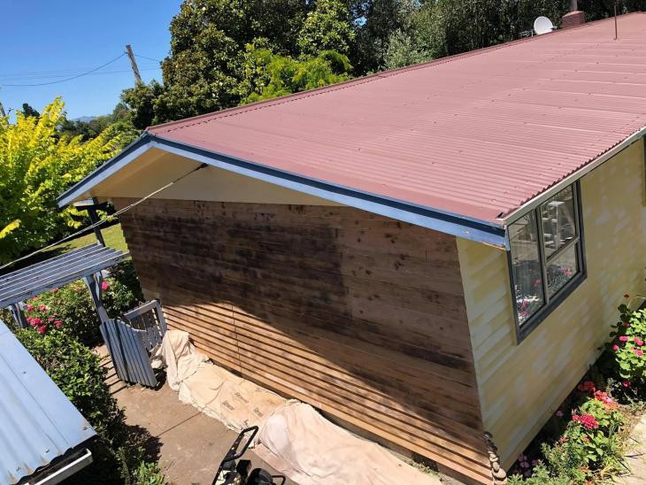 Roof after painting. Weatherboard after removing old paint