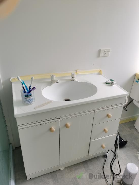 Install wall hung vanity & plumbing ( 608344) Builderscrack