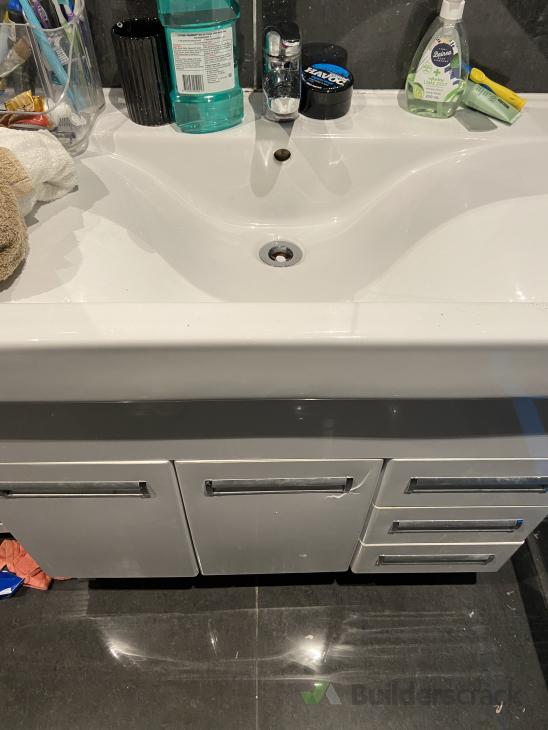 Crack in bathroom door vanity ( 624039) Builderscrack