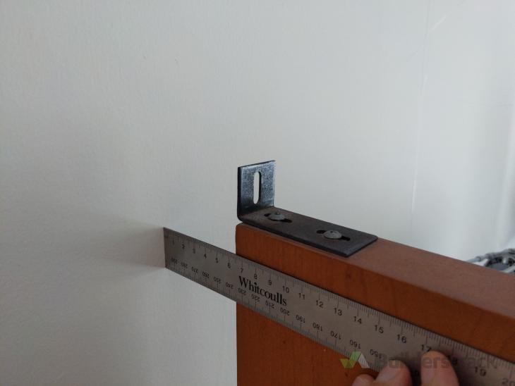 Securing large shelf to concrete wall for quake safety ( 703026