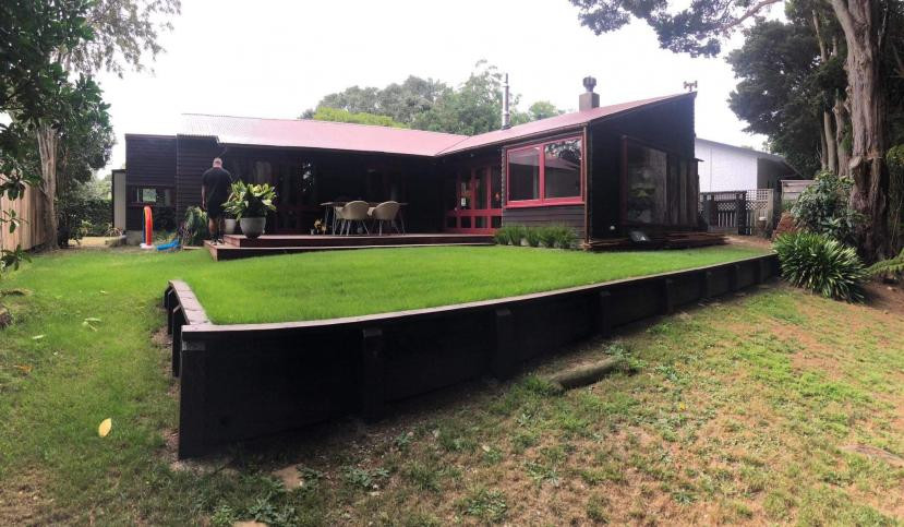 Retaining wall to raise backyard to utilise area for activities. Level backyard with topsoil