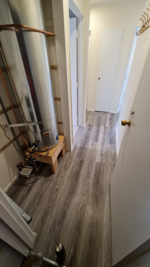 Passage way laminate flooring laid after builder finished with sub-floor.