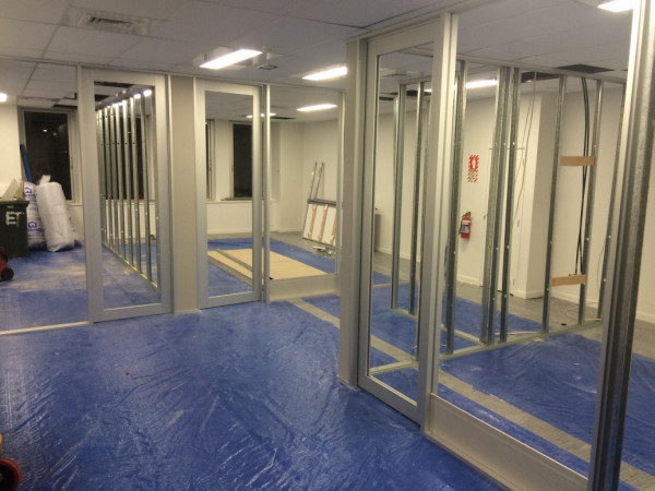 Office interior fitout-aluminium/steel stud walls ready for gib. Aluminium doors fabricated from stock extrusion  and hung, ready for glass.