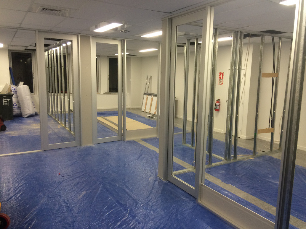 Office interior fitout-aluminium/steel stud walls ready for gib. Aluminium doors fabricated from stock extrusion  and hung, ready for glass.