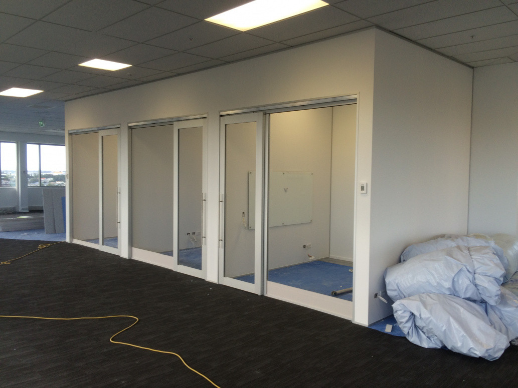 Meeting rooms built from steel stud, aluminium, sliding glazed doors fabricated on site.