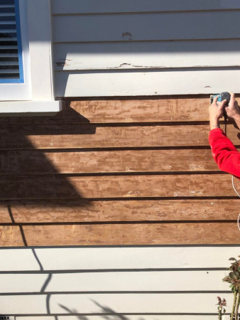 Stripping back old paint and power sanding surface smooth