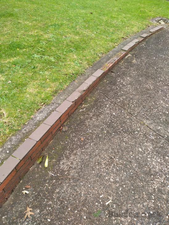 Replace capping tiles on brick retaining wall in driveway ( 747837) Builderscrack